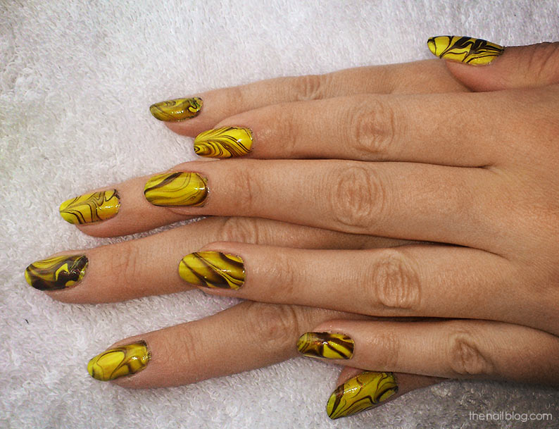 Yellow water marbling nails