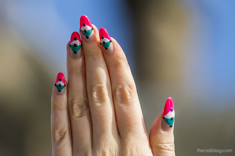 Geometric nail design with black rhinestones